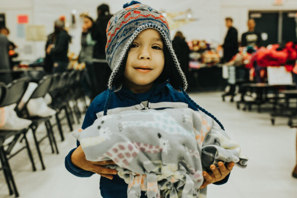 kid with a blanket