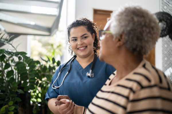 Nurse helping eldery lady