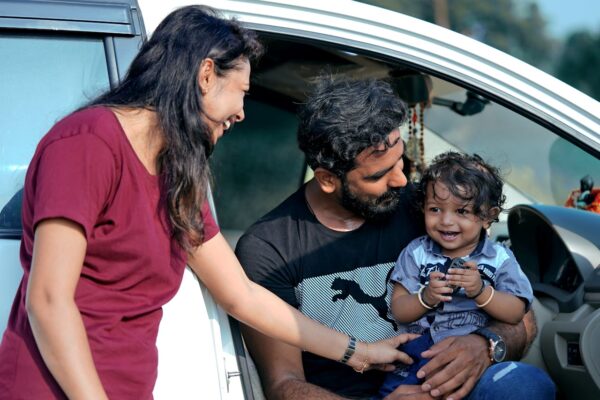 Family with otddler in car